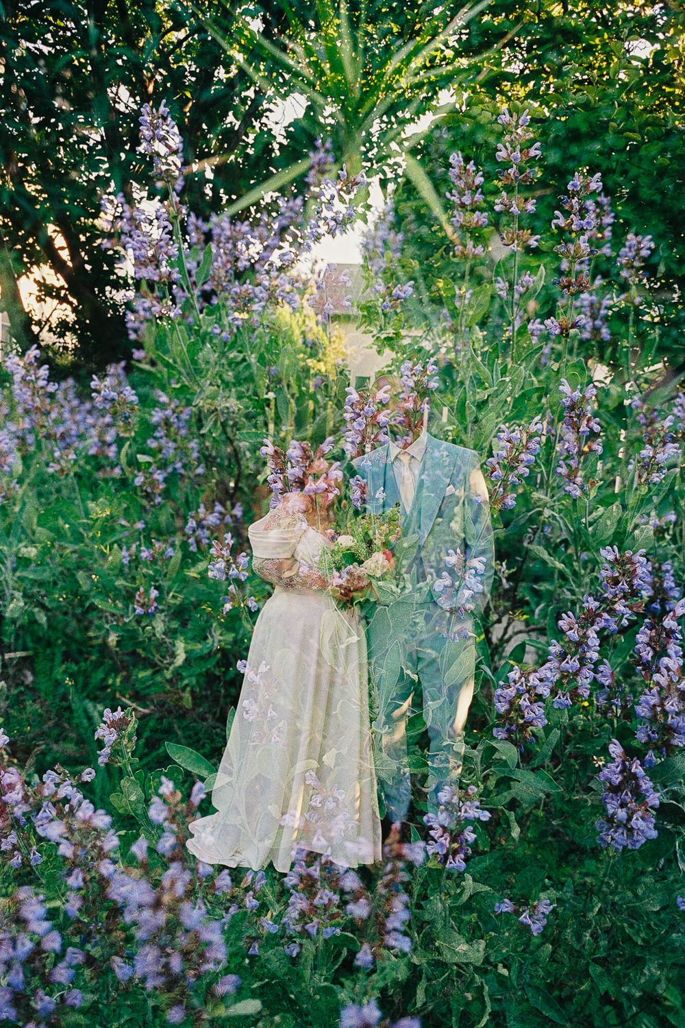 Double exposure wedding photo of bride and groom blending with purple wildflowers and lush green garden foliage.
