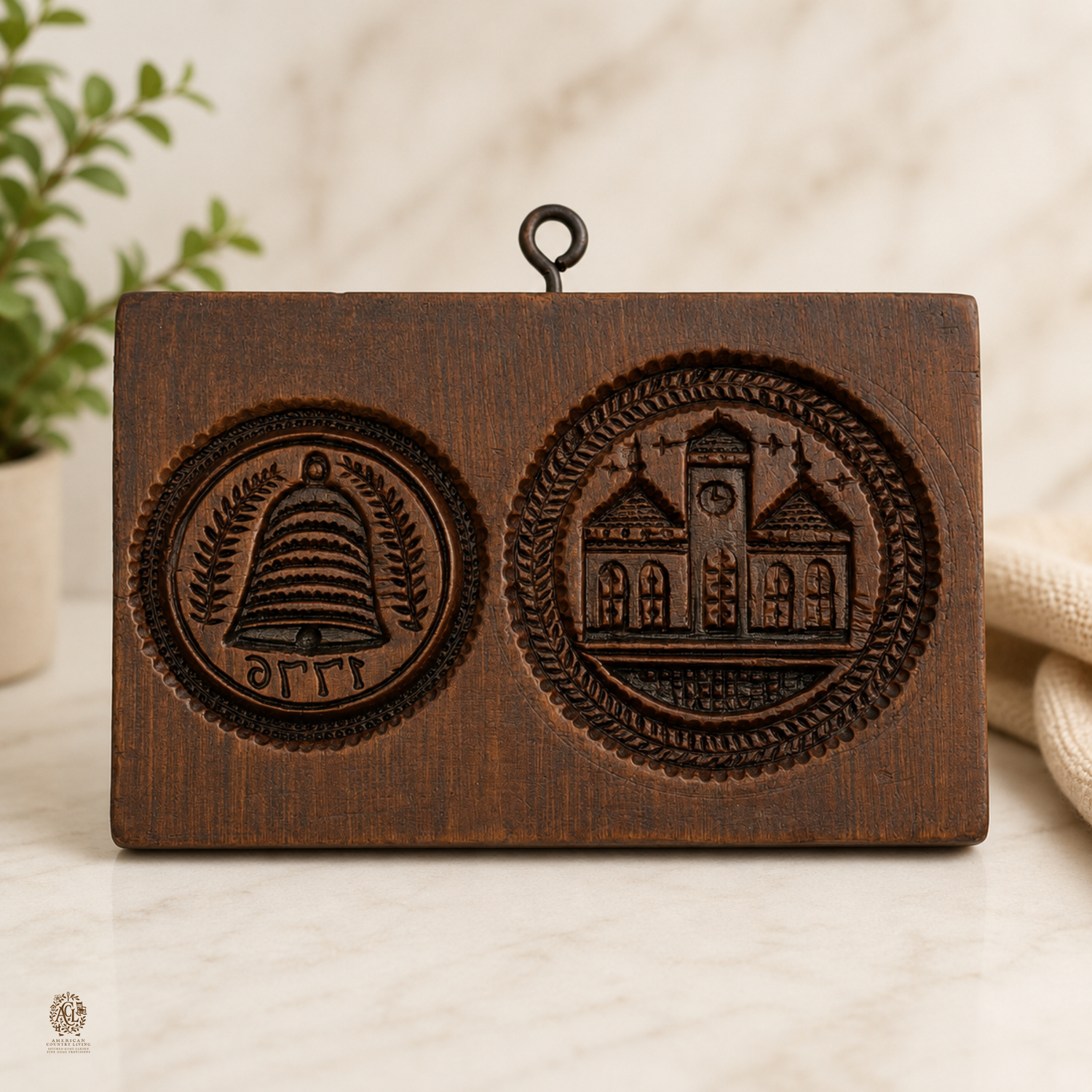 Wooden springerle cookie mold with two carved medallions featuring a bell and a church building design.