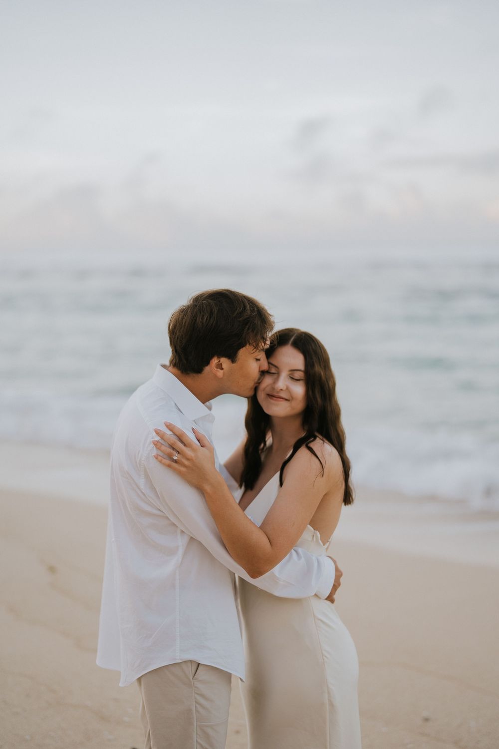 Romantic engagement couple photoshoot at Melasti Beach, Bali.