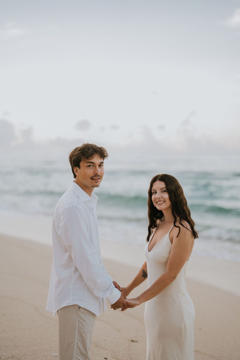 Romantic engagement couple photoshoot at Melasti Beach, Bali.