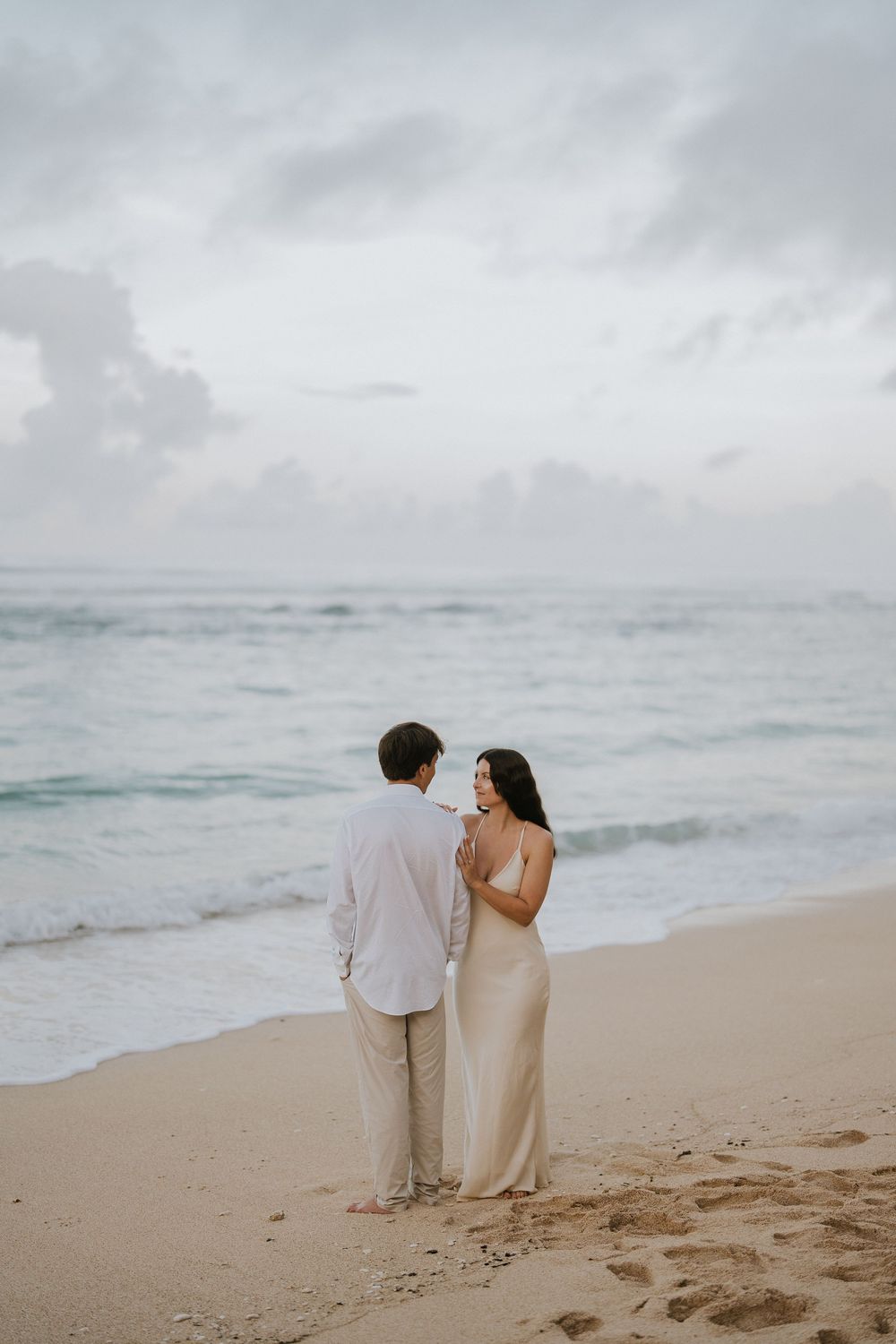 Romantic engagement couple photoshoot at Melasti Beach, Bali.
