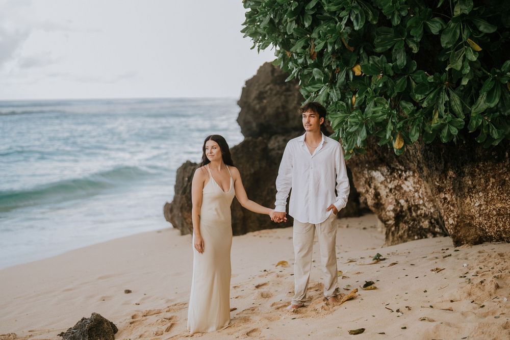 Romantic engagement couple photoshoot at Melasti Beach, Bali.