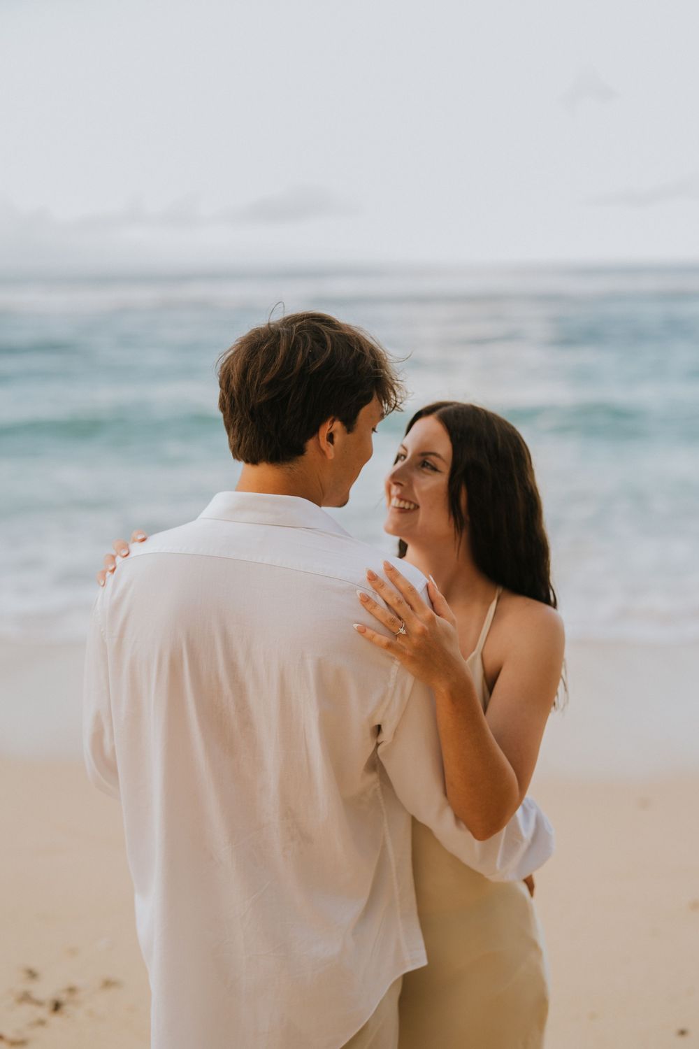 Romantic engagement couple photoshoot at Melasti Beach, Bali.