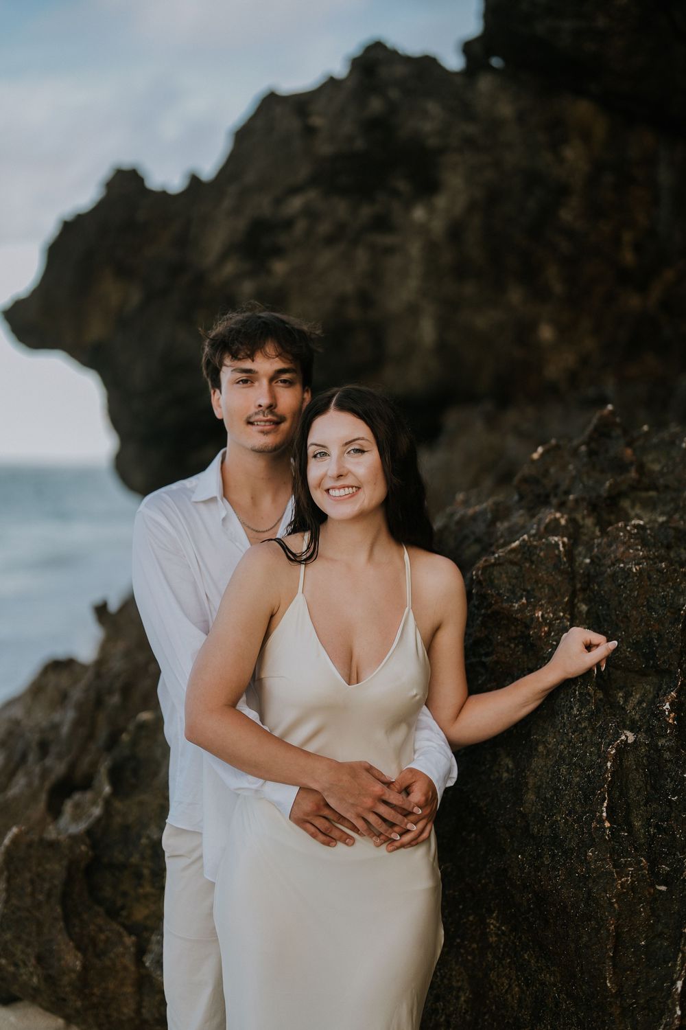 Romantic engagement couple photoshoot at Melasti Beach, Bali.