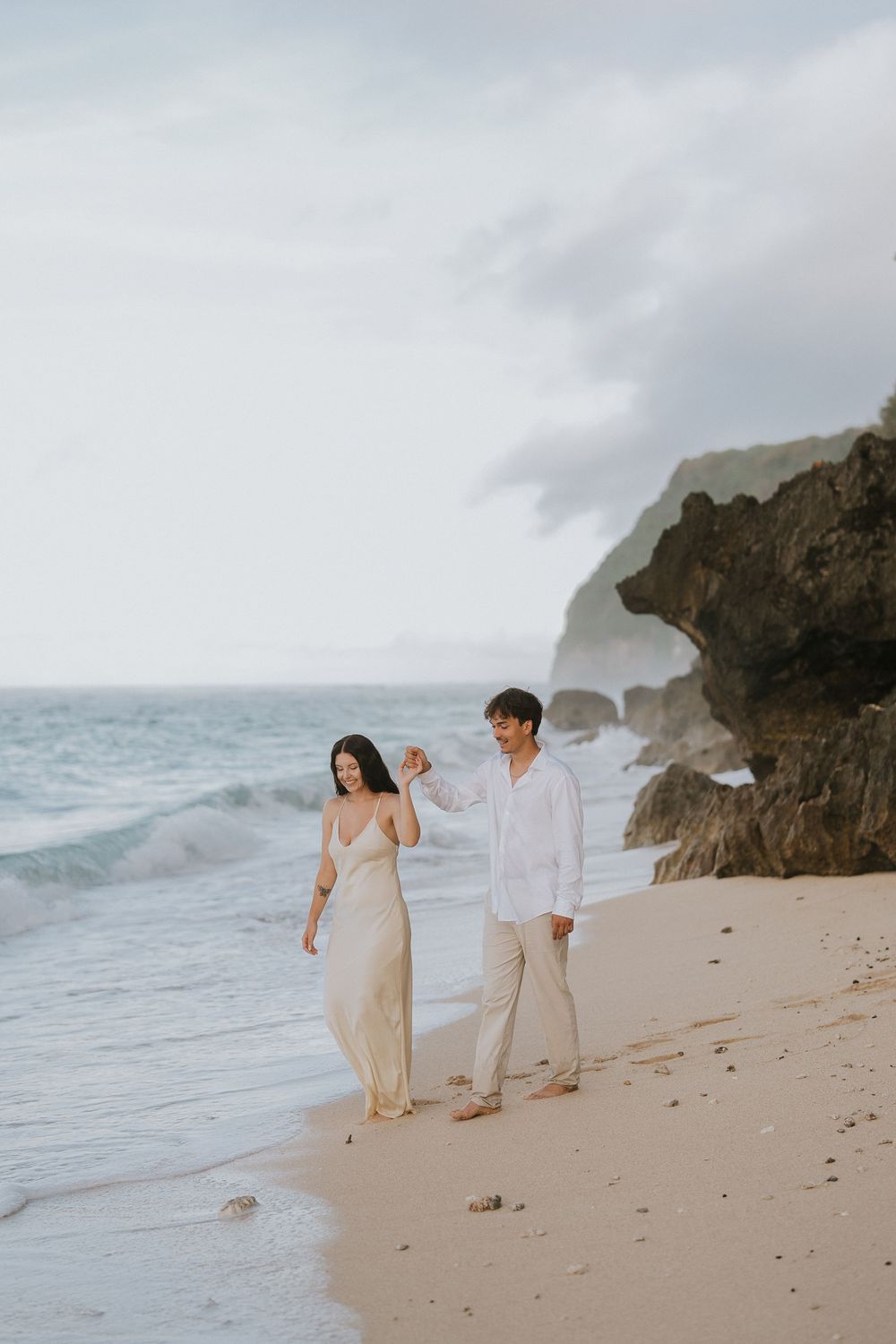Romantic engagement couple photoshoot at Melasti Beach, Bali.