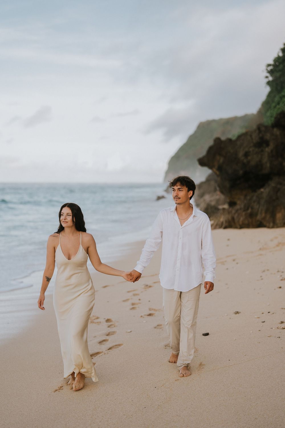 Romantic engagement couple photoshoot at Melasti Beach, Bali.