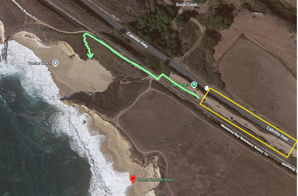 Aerial satellite map showing a coastal trail route marked in green near cliffs and beach access points.