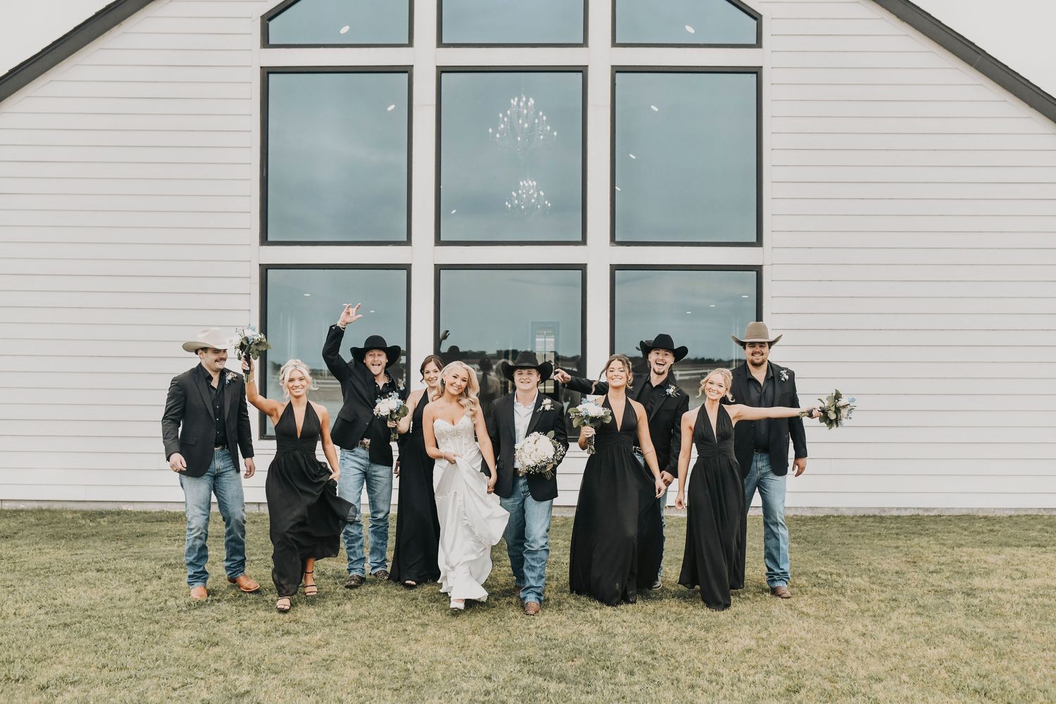 Bridesmaids and groomsmen celebrating after wedding ceremony