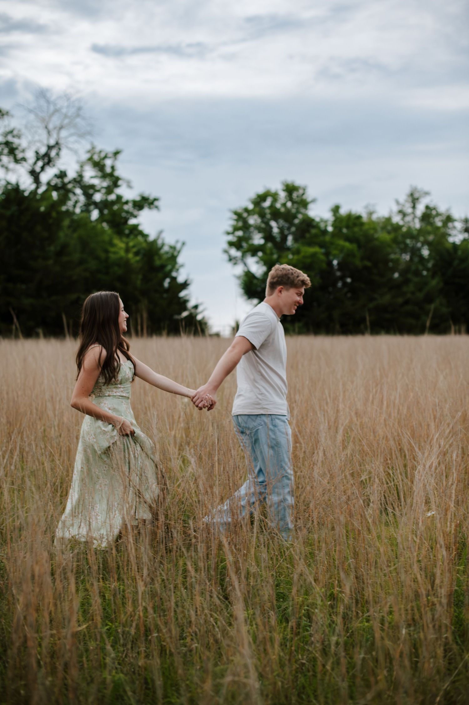 Wichita KS outdoor engagement photos in nature location Andover, couple photos in field with flowers, small elopement wedding photographer