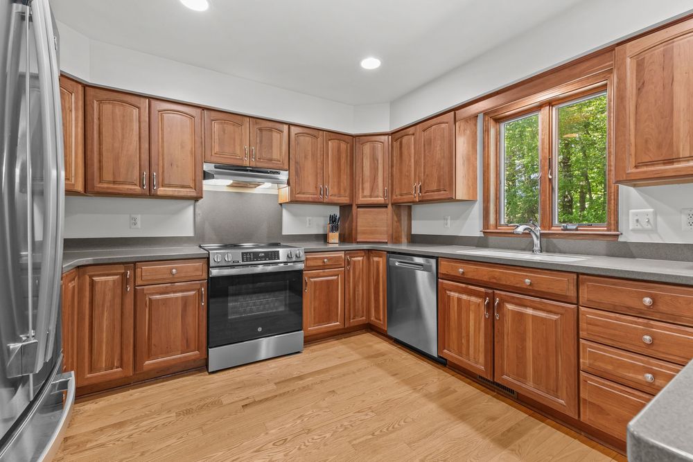 Modern kitchen with island in Metamora Michigan home