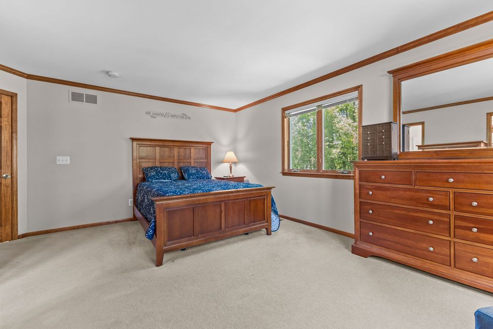 Primary bedroom in luxury Metamora Michigan home