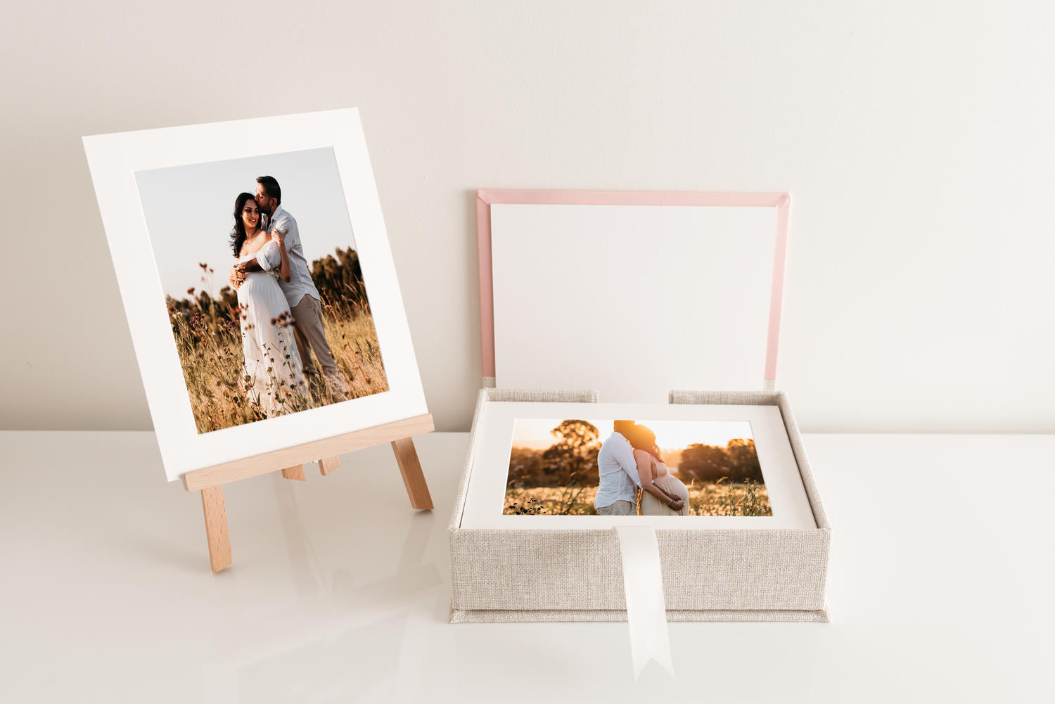 Canvas maternity portrait of a couple embracing, showcasing the beauty of pregnancy with the mother-to-be in a fitted dr