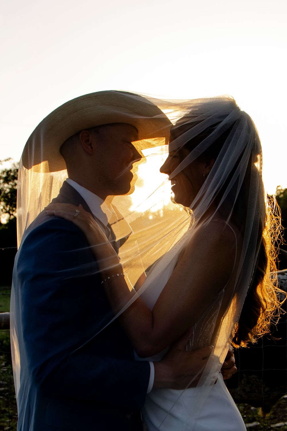 Dripping Springs hill country wedding couple photos at Longhorn ranch venue