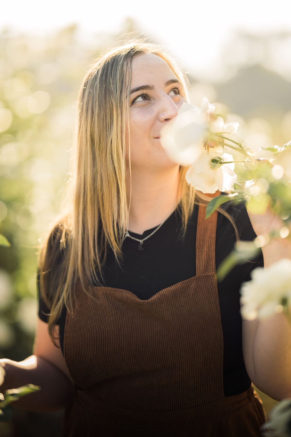 a female model poses in the flower gardens at the Los Angeles History Museum