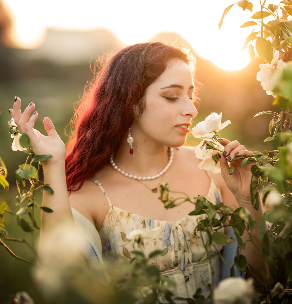 a female model poses in the flower gardens at the Los Angeles History Museum