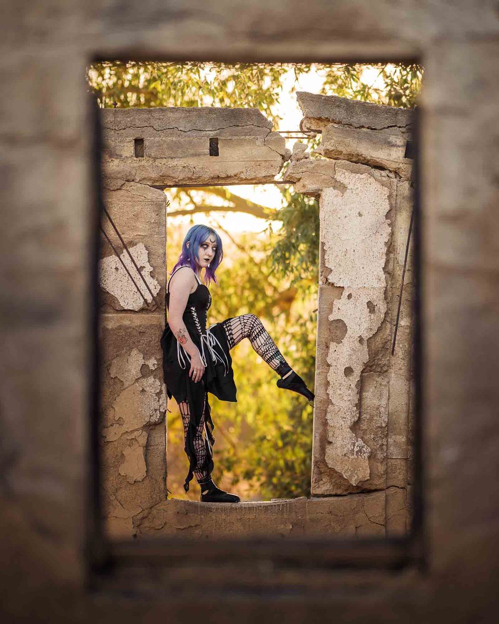 female ballet dancer in dark alternative attire in old building ruins with photographer ChrisCornishPhotography