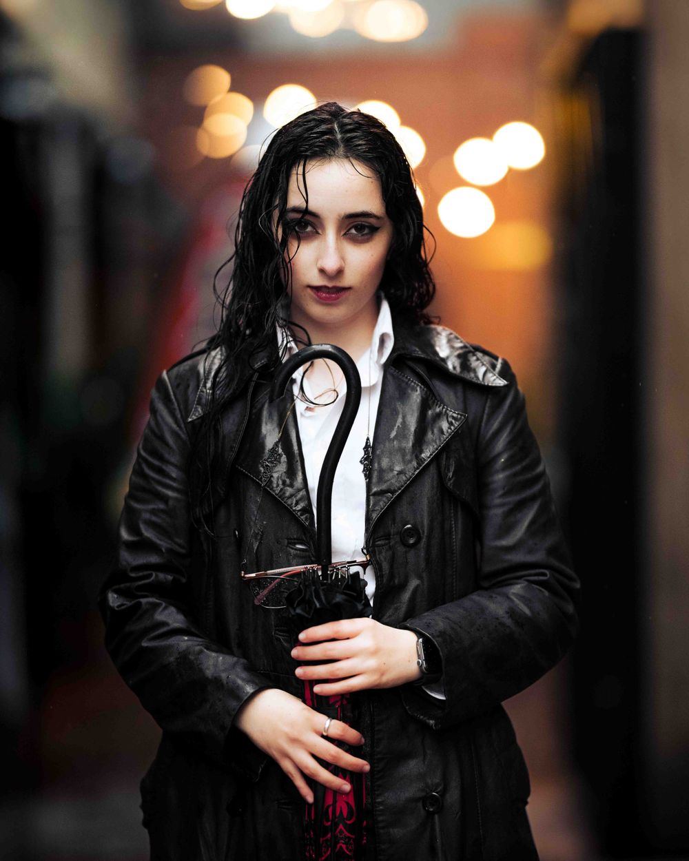 Model stands in the rain at night with soaked hair and dramatic lighting, captured by Chris Cornish Photography.