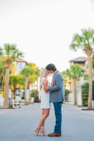 couple kissing in the street engagement portraits Panama City Beach Florida