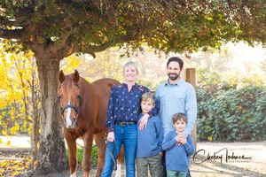 Family portrait with their horse at Apple Creek in Sebastopol, CA, captured by an equine photographer