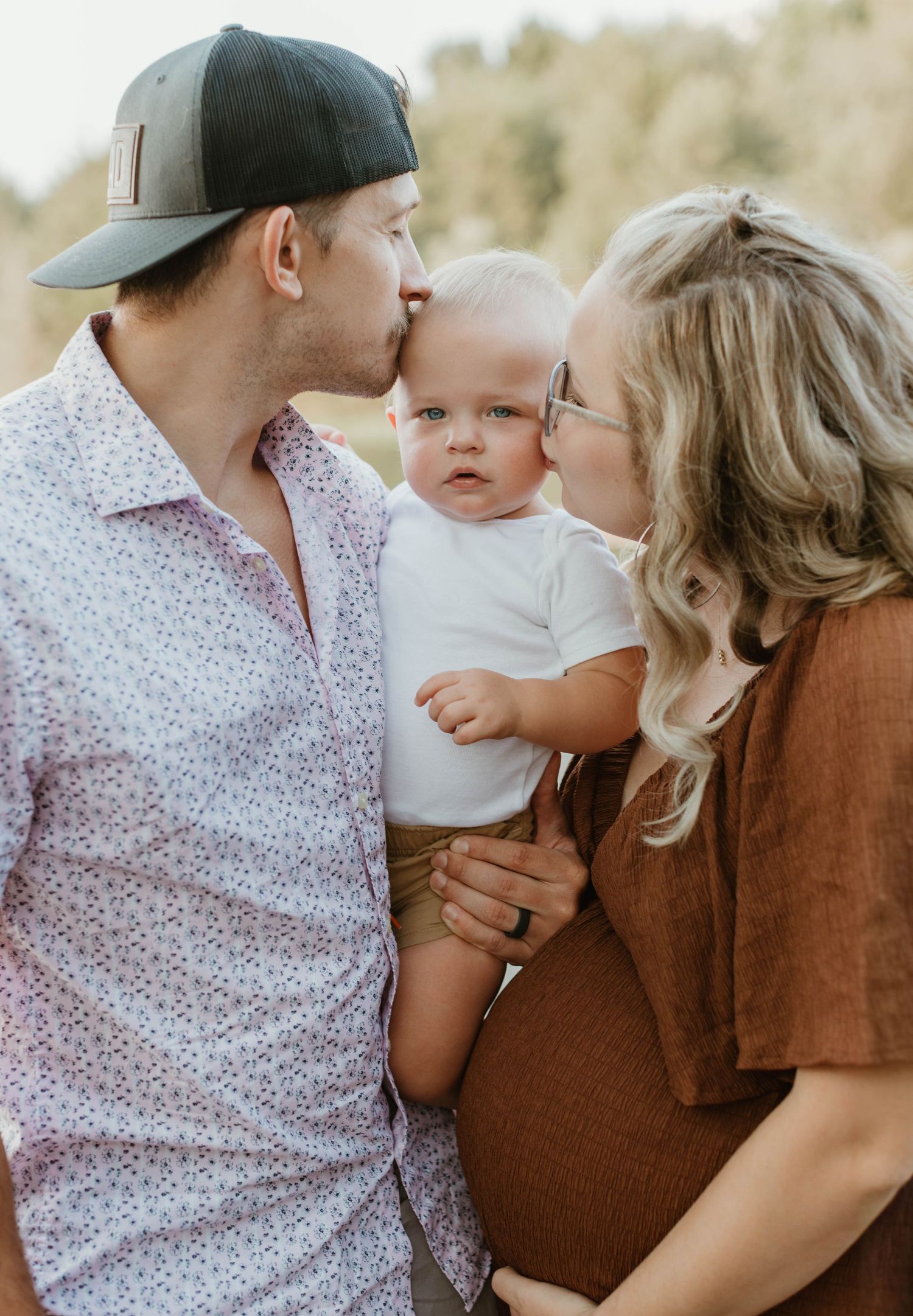Sweet family moment captured in a series of tender outdoor portraits.