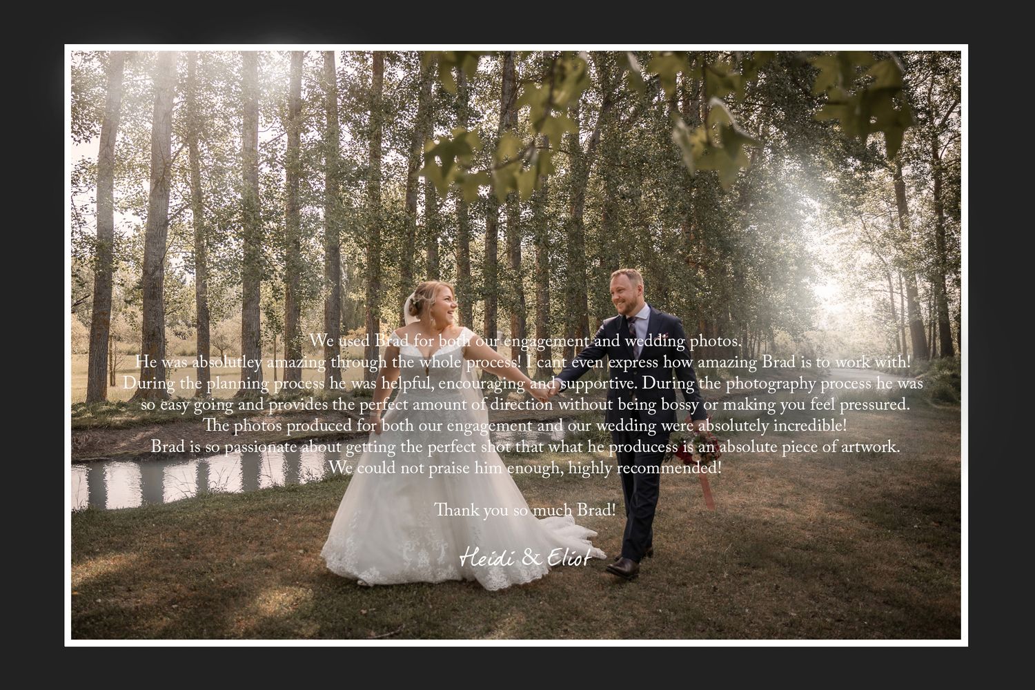 A wedding couple walks along a tree-lined path with sunlight streaming through.
