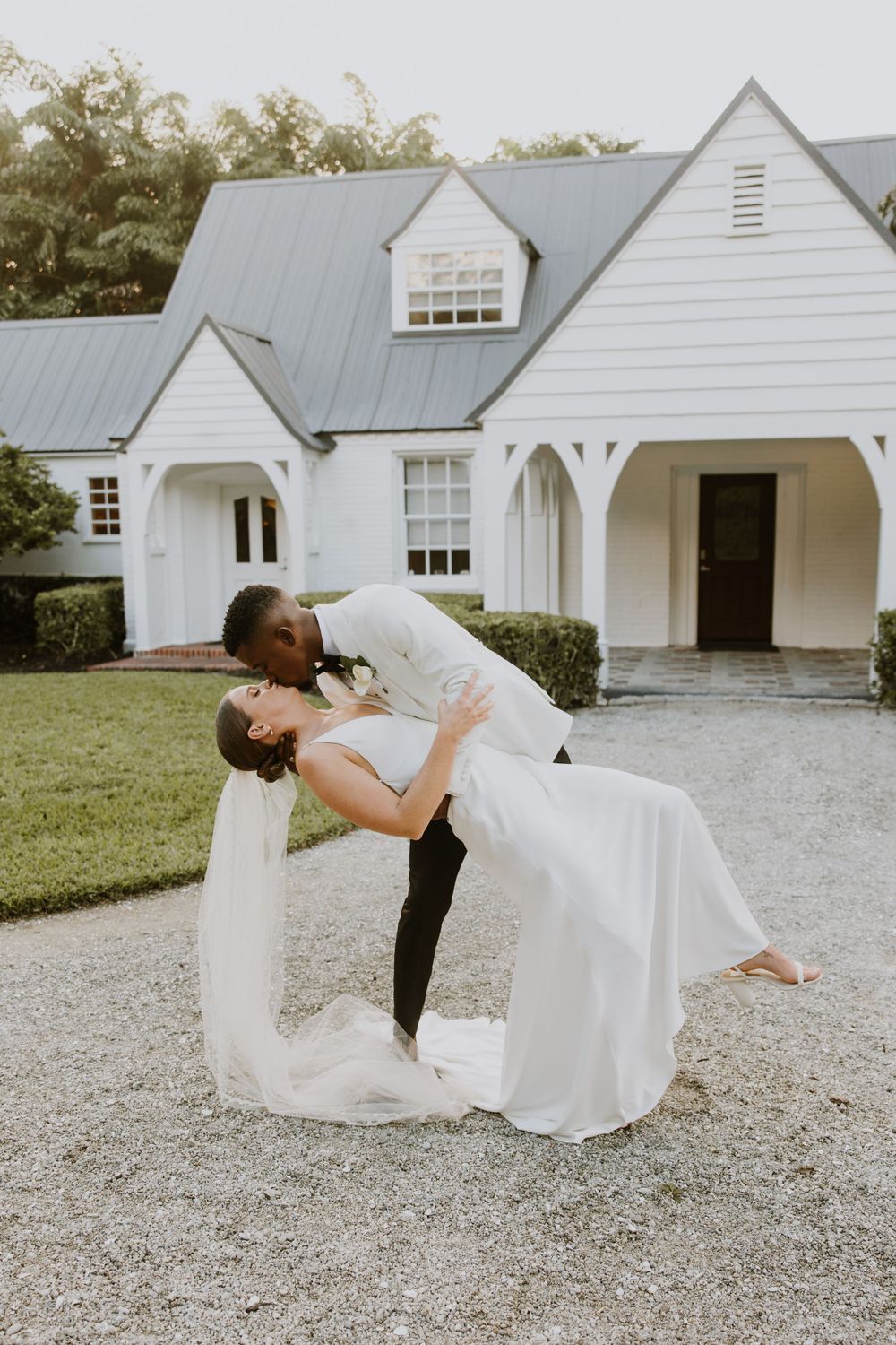 Golden Hour Bride & groom photos at wedding in Fort Pierce, FL at The Lake House venue captured by Lindsay McDow Photography. Vowd Weddings