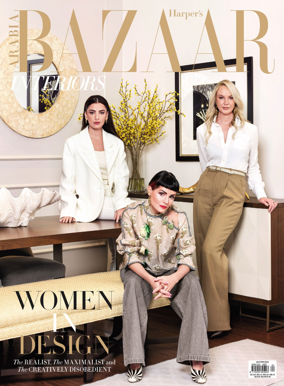 Magazine cover featuring gold text and artistic layout.