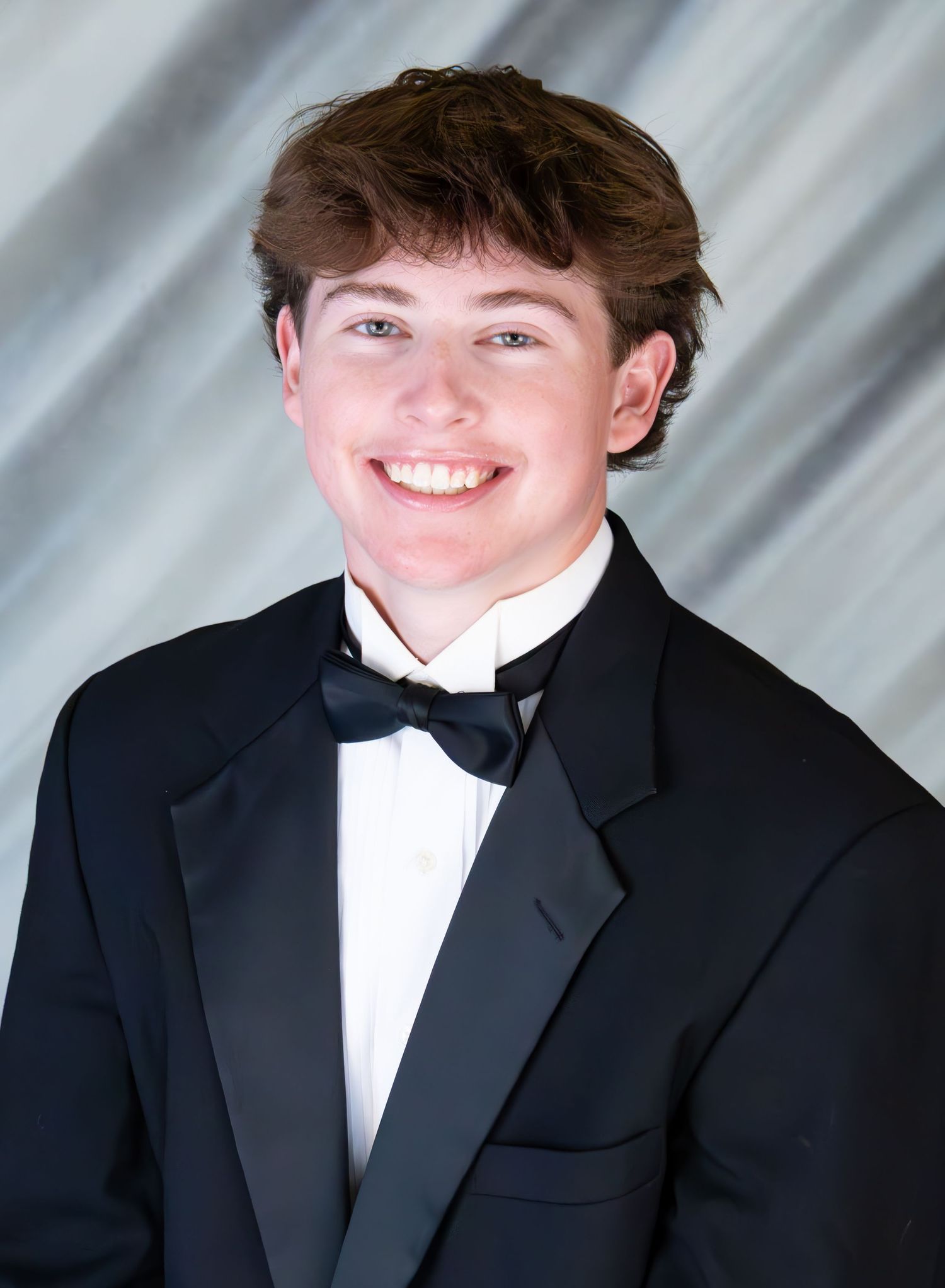 senior boy in tux