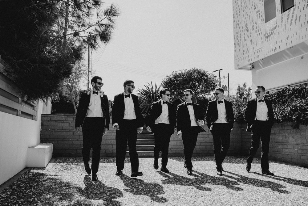 A black and white photo sequence shows a wedding party walking together along an outdoor path.