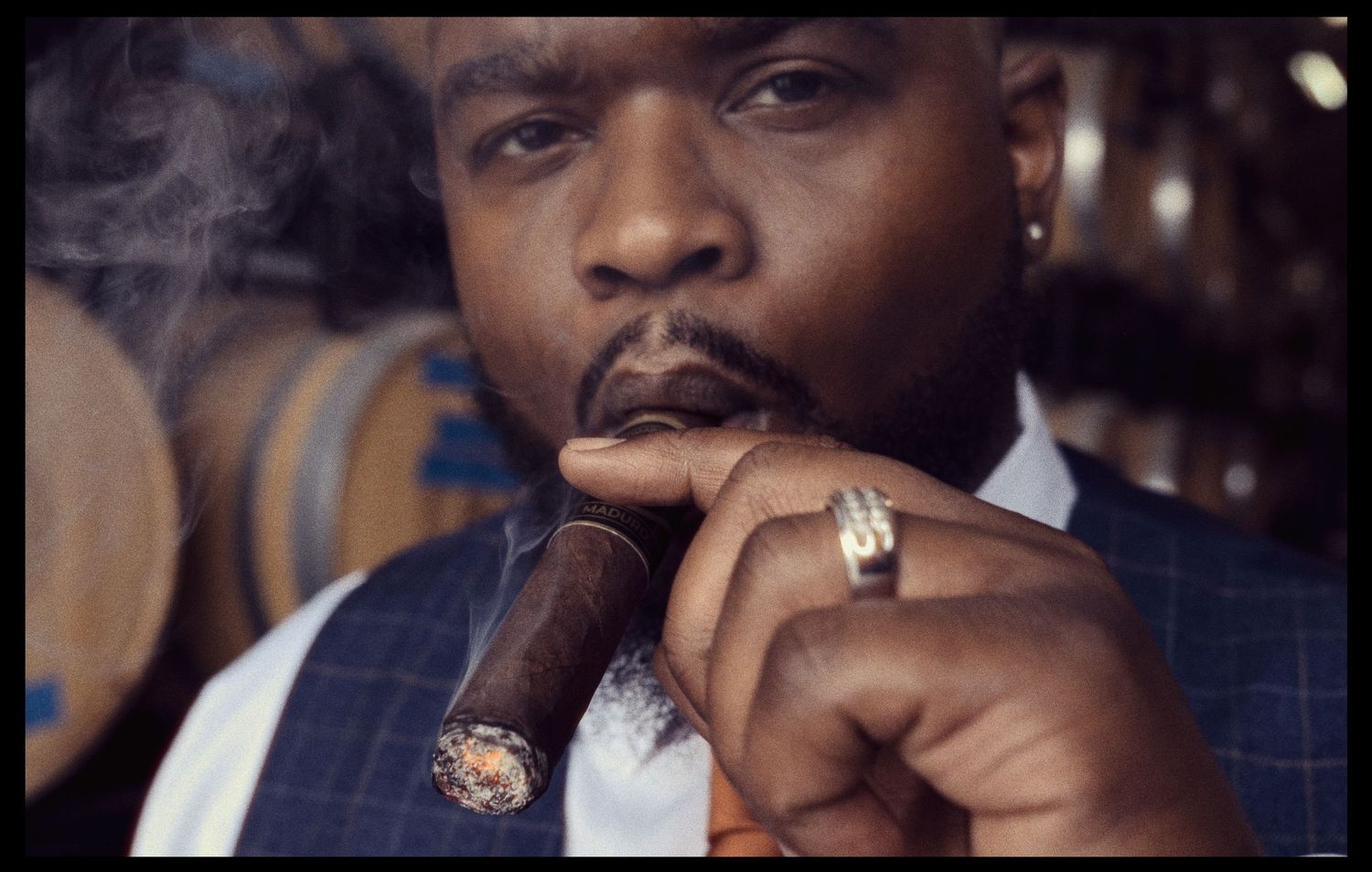 A photo collage showing multiple scenes of someone smoking a cigar in elegant lighting and settings.