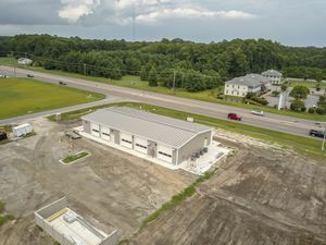 Aerial photograph showing development progress of a commercial property with surrounding vacant land.