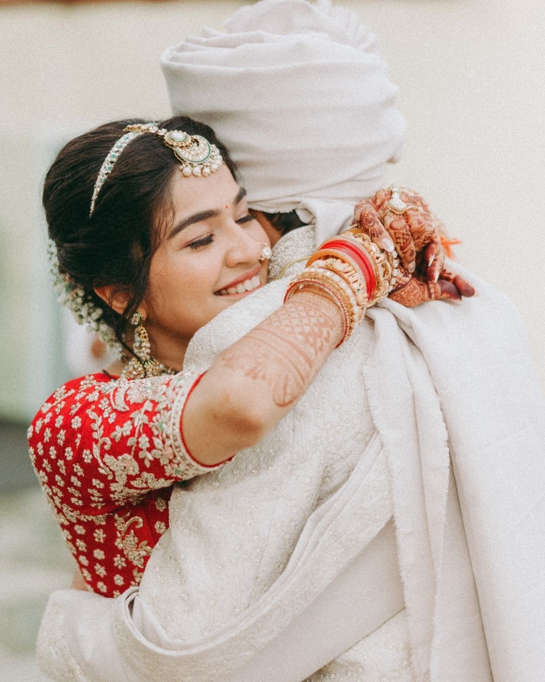 Looking for a wedding photographer in Mumbai? Romantic Indian red & white wedding couple close-ups by Mumbai's finest wedding photographer.