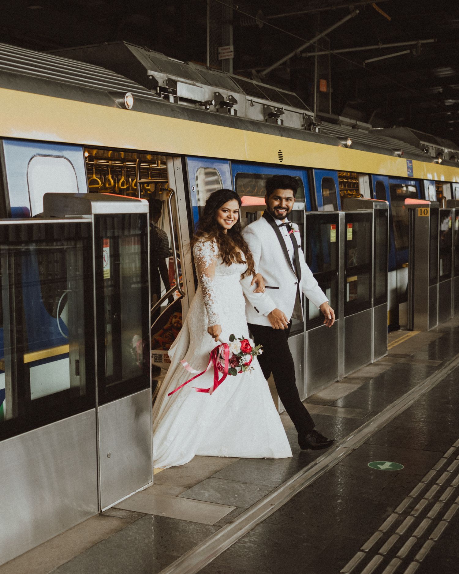 Creative wedding photo sequence of couple posing at a subway platform, uniquely captured by a professional wedding photographer in Mumbai.