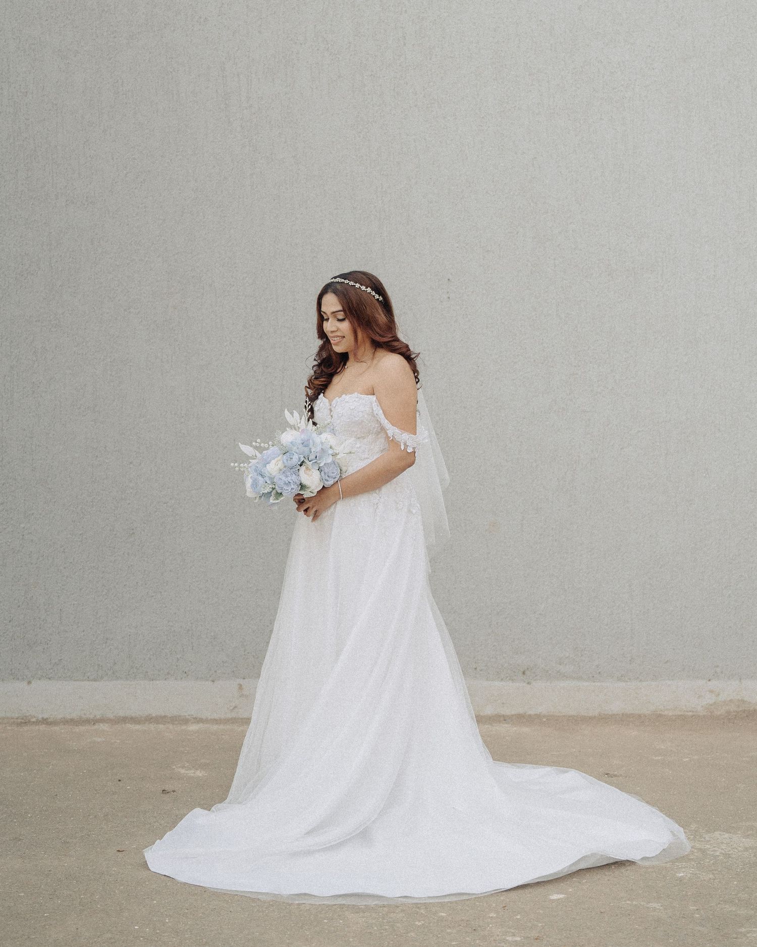 Looking for a wedding photographer in Mumbai? Elegant flowing white bridal dress portraits by Mumbai's finest wedding photographer.
