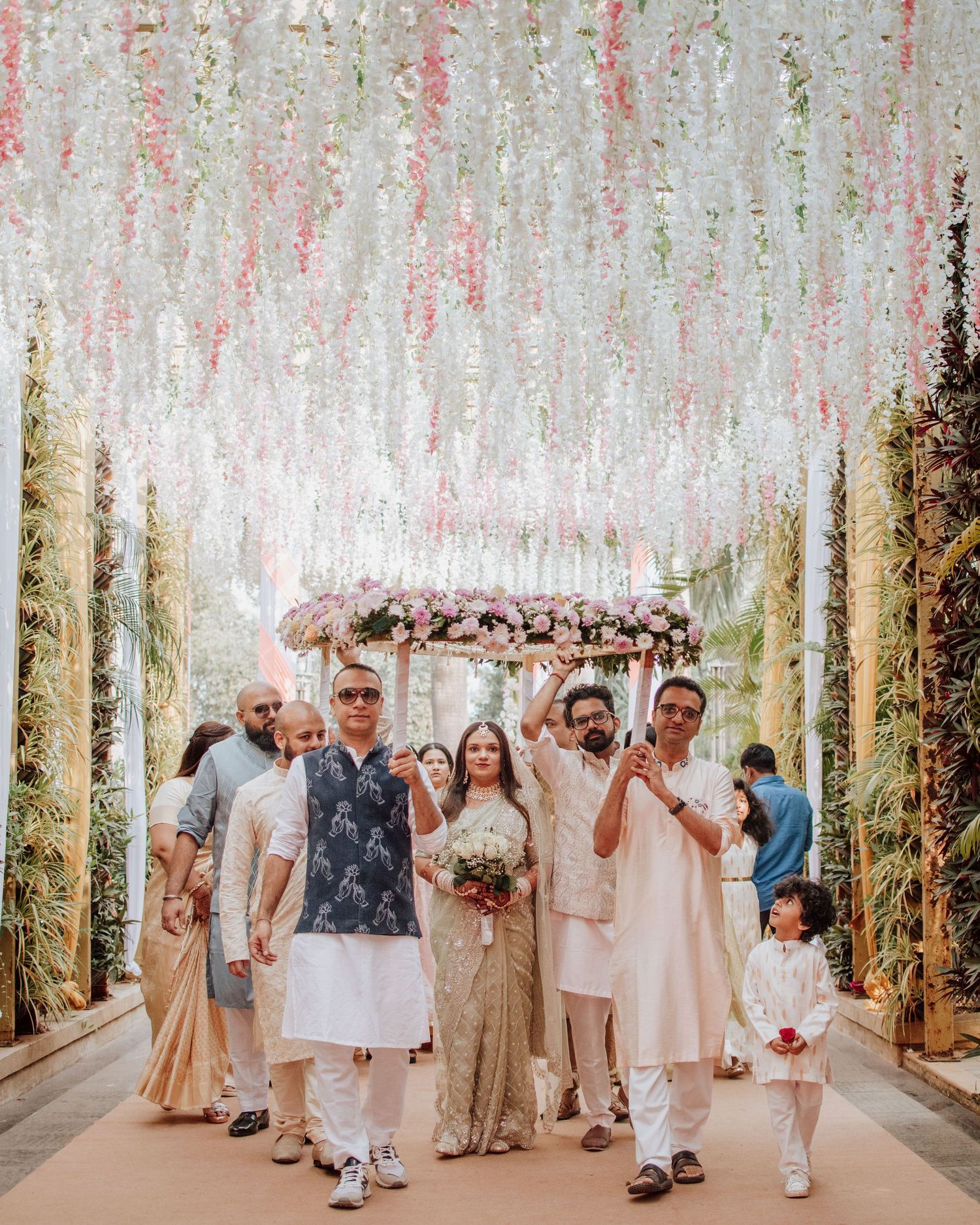Looking for a wedding photographer in Mumbai? Elegant hanging floral wedding ceremony in pastels by Mumbai's finest wedding photographer