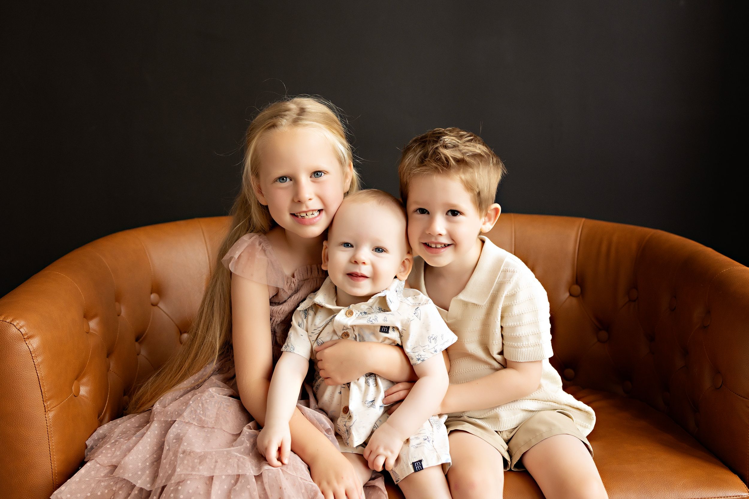 Three young children together in family photography Watertown WI