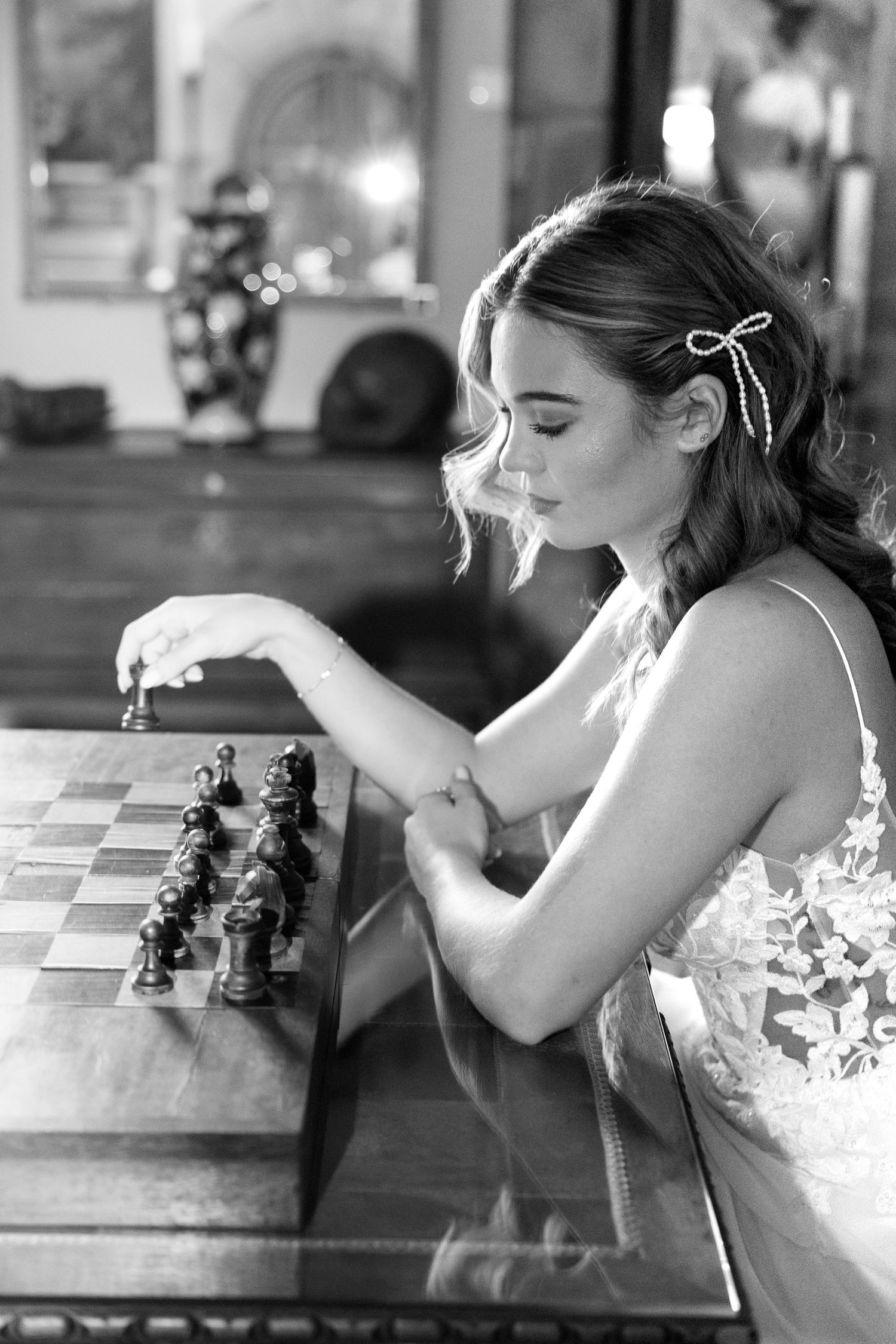 A black and white photo series showing someone contemplating moves during an intense chess match at a table.