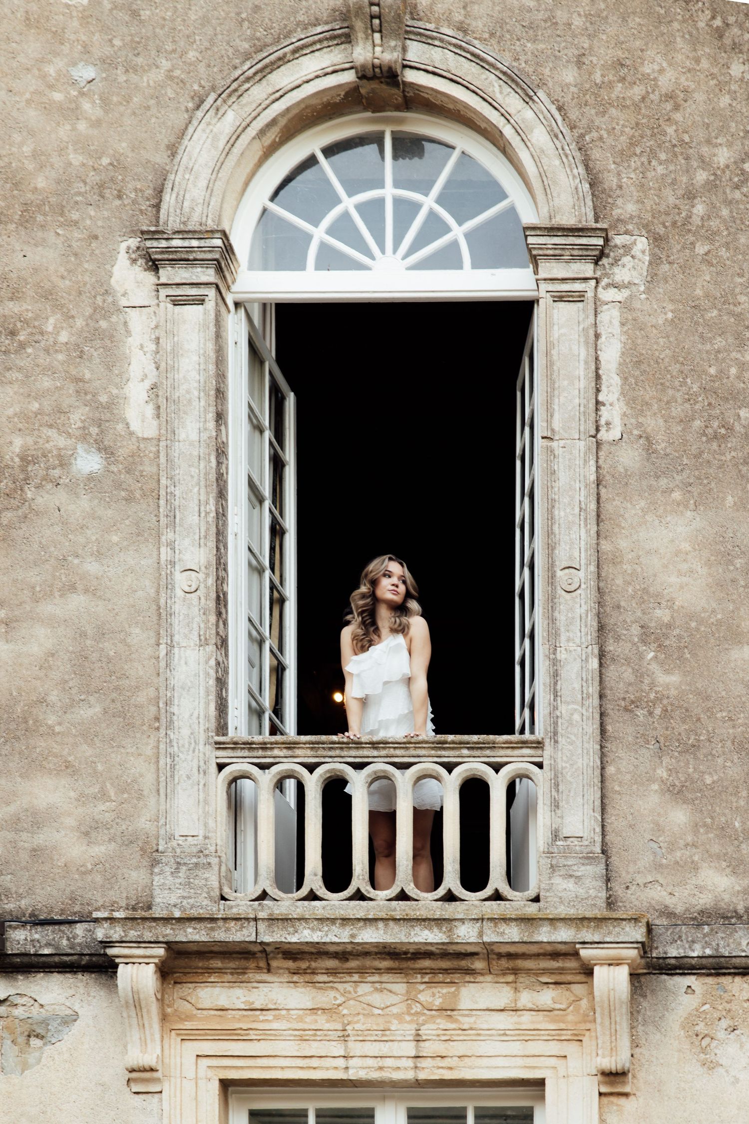 A series of architectural photos showing an elegant stone balcony with arched windows and classical details.