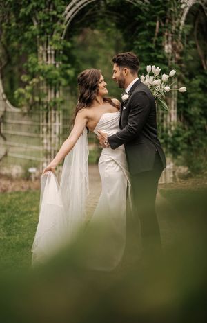 A romantic wedding couple shares intimate moments in a garden setting captured in a series of artistic photographs.