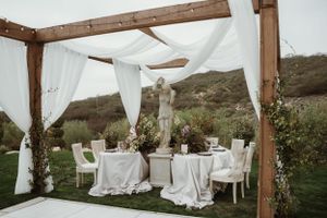 Elegant tablescapes adorned with lush florals and fine china, setting the scene for an oceanside celebration.