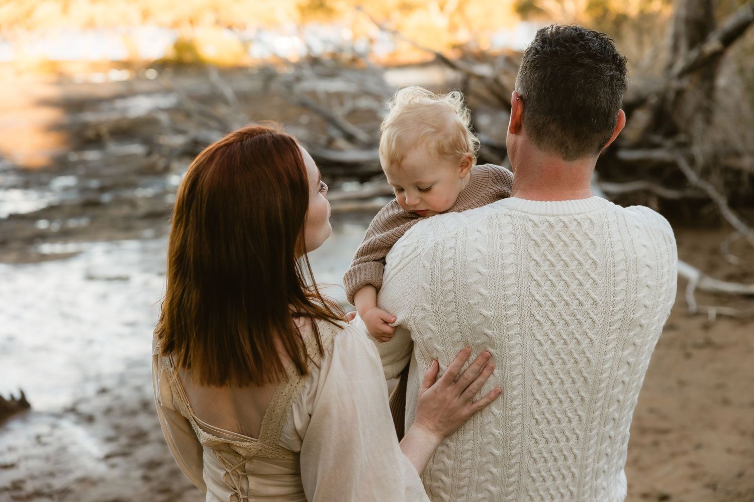 Family laughing and having fun during a family photo shoot in a park in Arana Hills, Brisbane