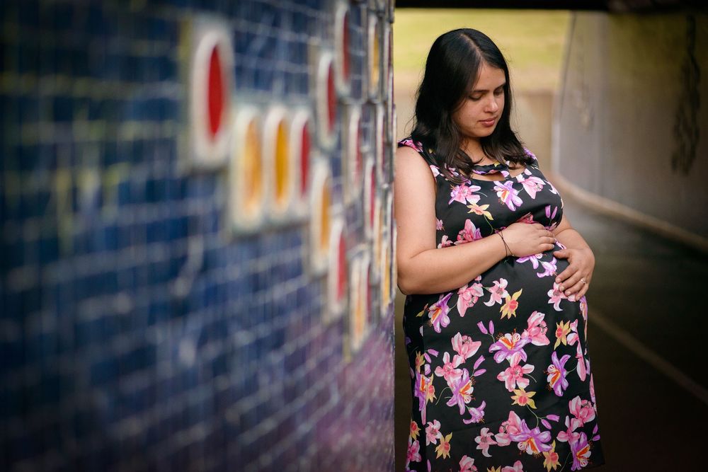 Pregnant woman in floral dress - Kelly Chapman Photographer Perth