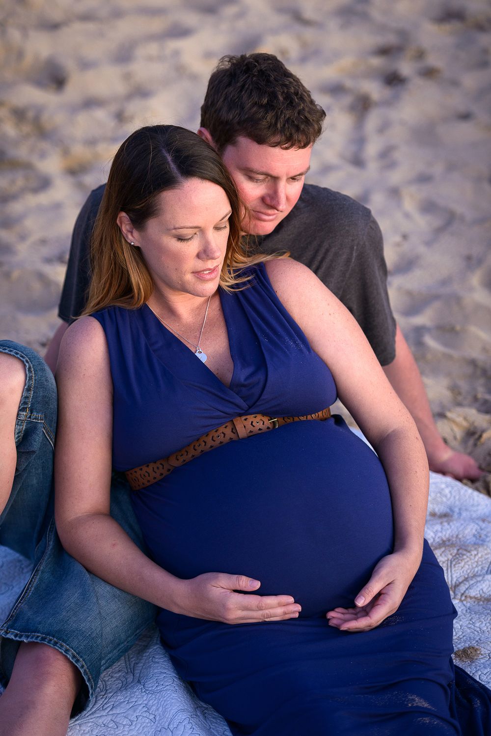 Pregnant woman with husband at the beach - Kelly Chapman Photographer Perth