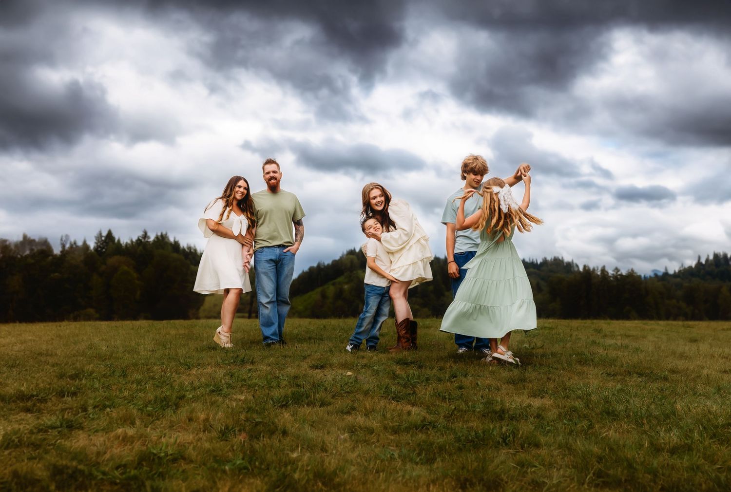 Family session with moody skies at Alder Lake in Eatonville