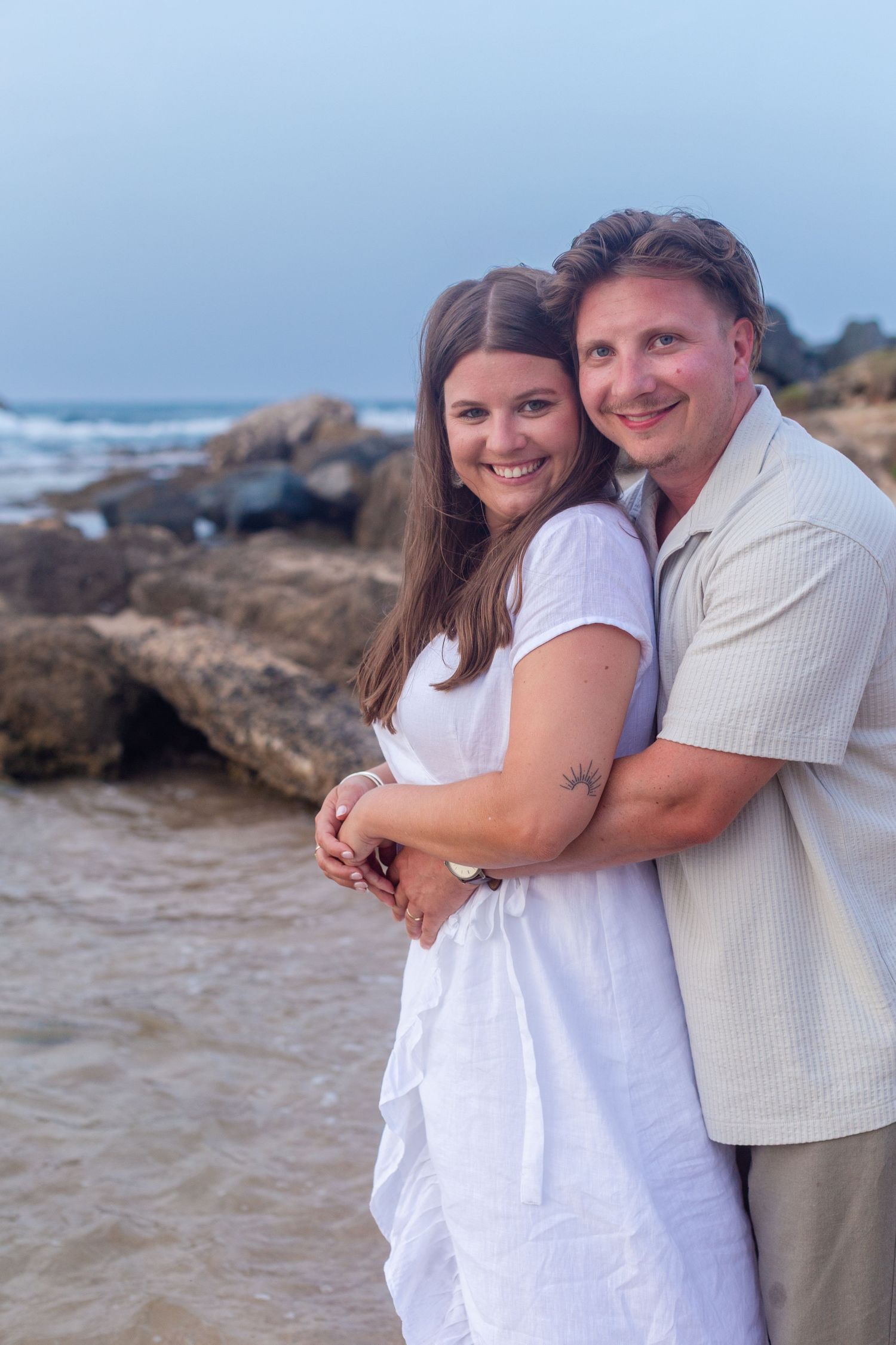 Couples portrait on the beach at Balneario del Escambrón in Old San Juan, Puerto Rico.