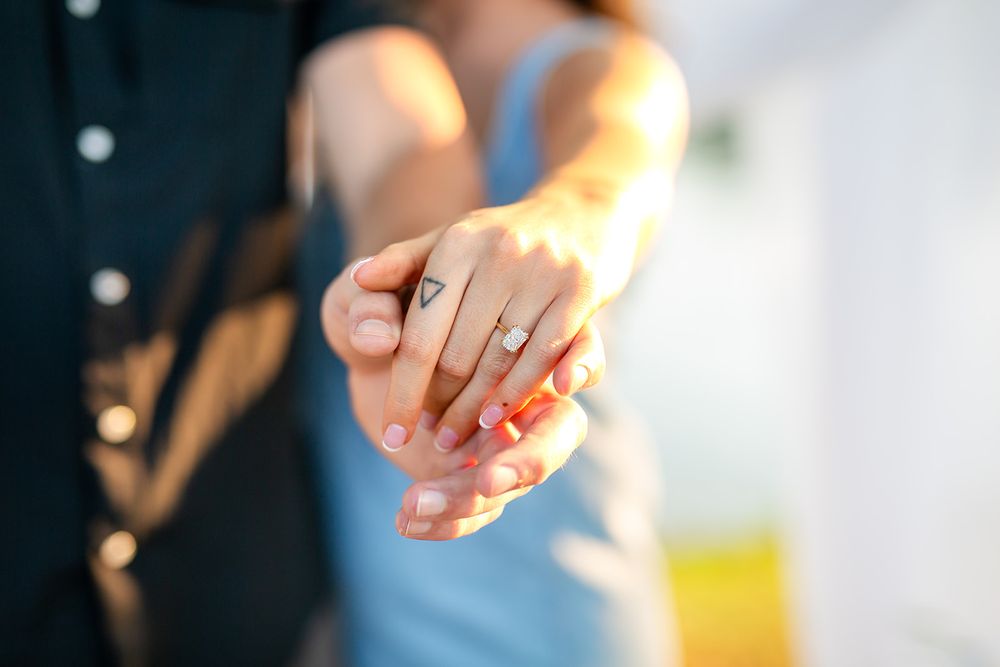 Close-up of an engagement ring on a newly engaged woman's hand after a surprise proposal in Mountain Home, Arkansas