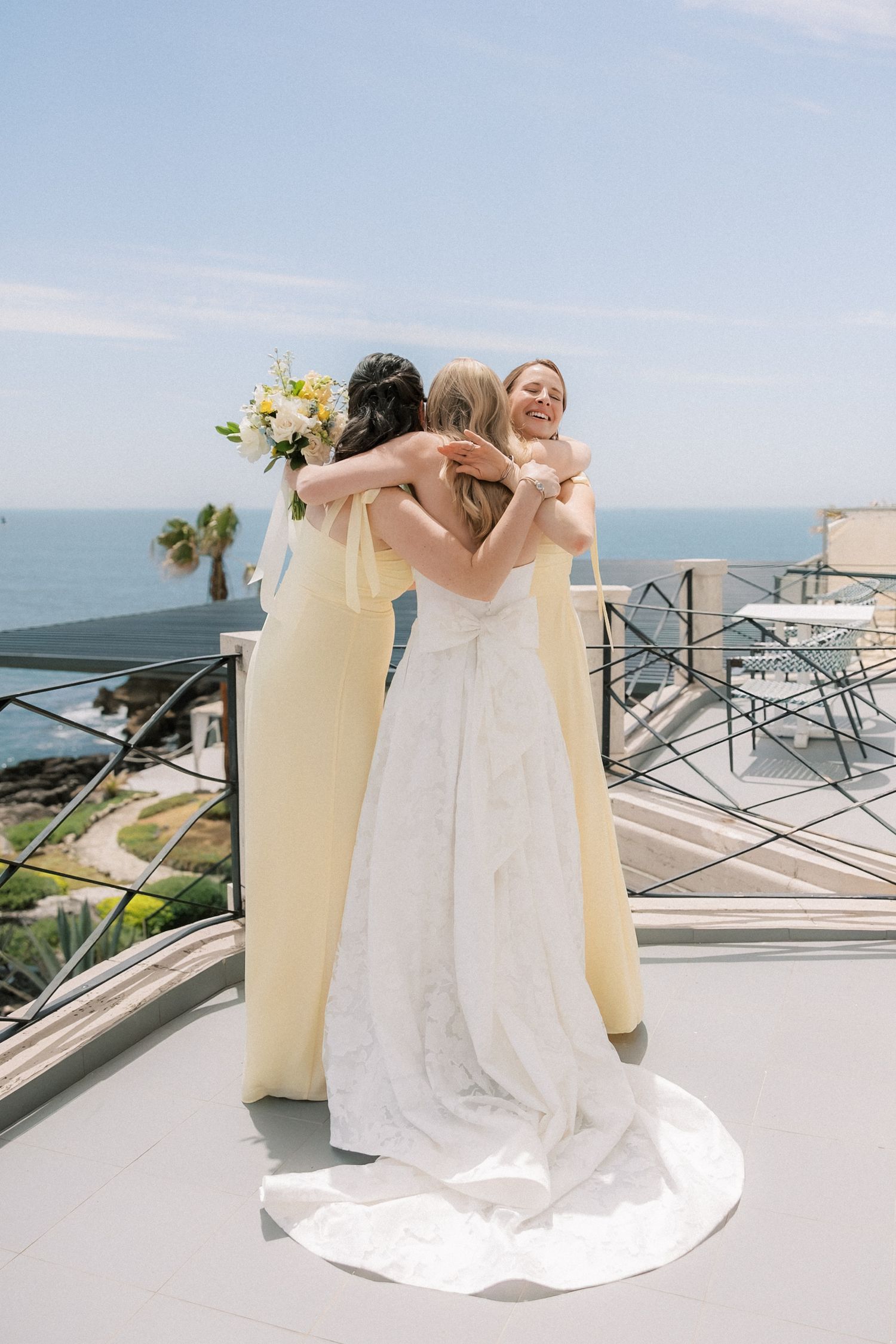 Bride celebrating with her bridesmaids before the ceremony at Arriba by the Sea, a beautiful destination wedding venue in Cascais.