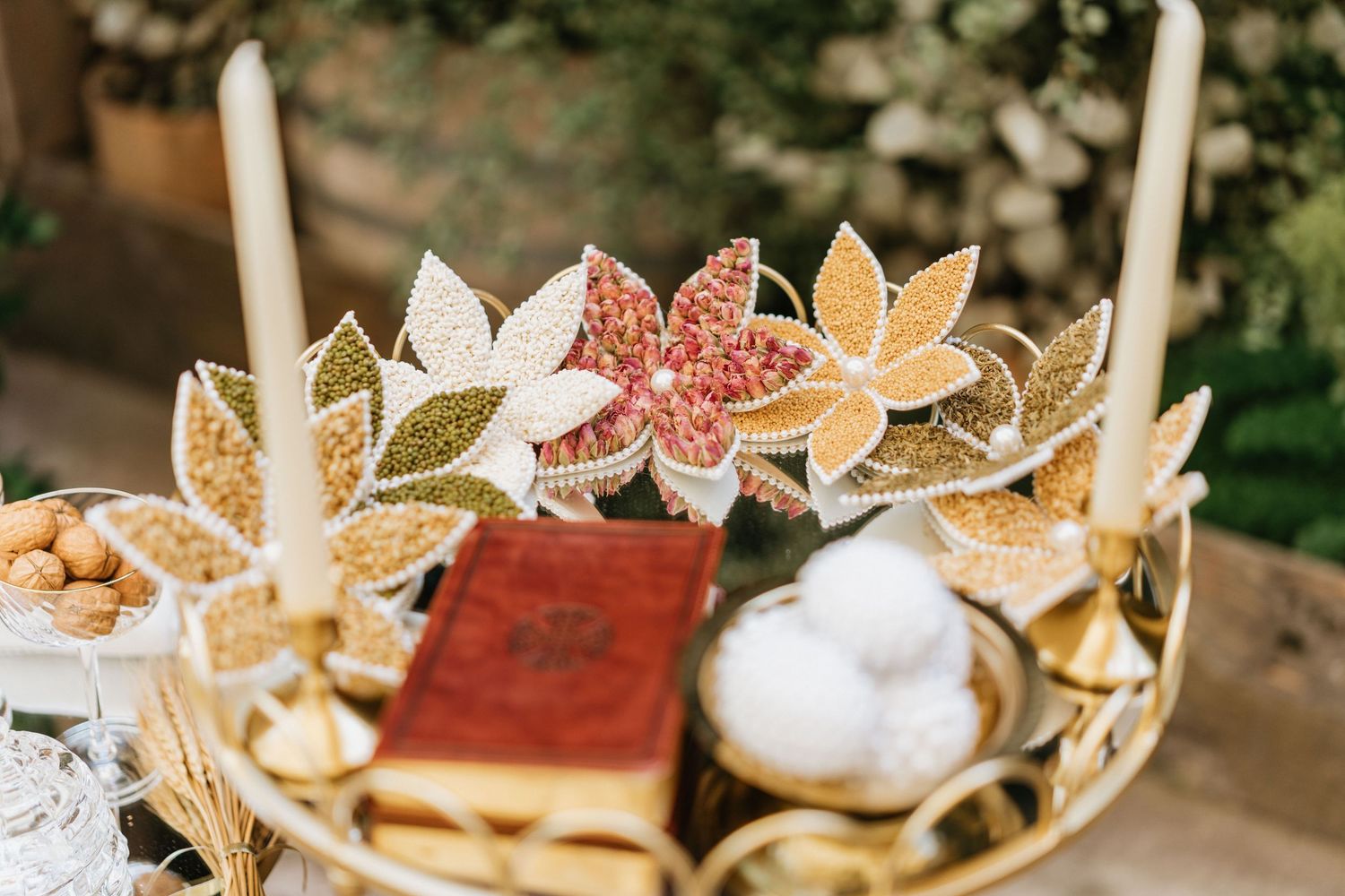 Wedding ceremony table with decorative Bible, candles, and ceremonial details before the ceremony.