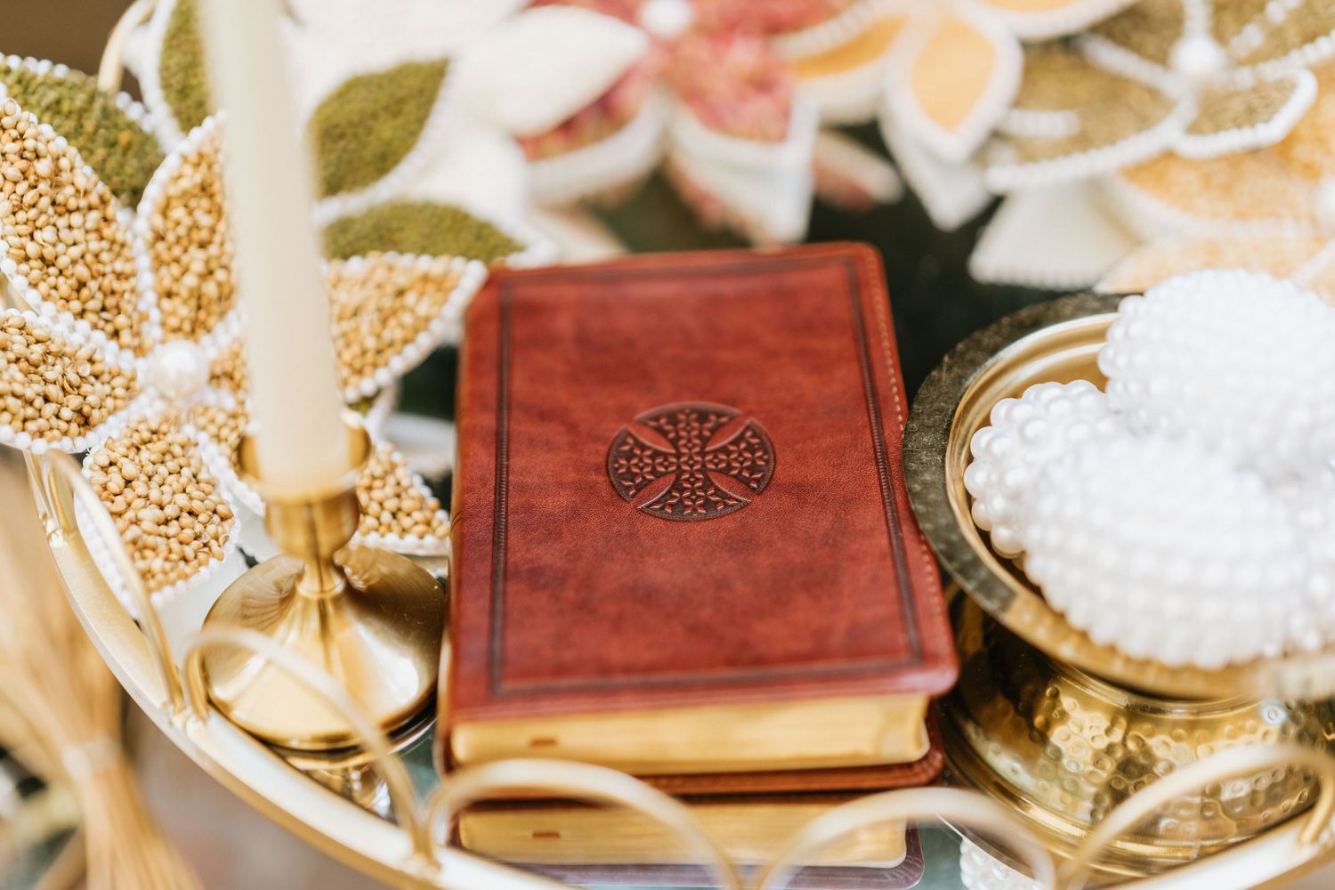 Close-up of the ceremonial Bible displayed with elegant wedding décor.