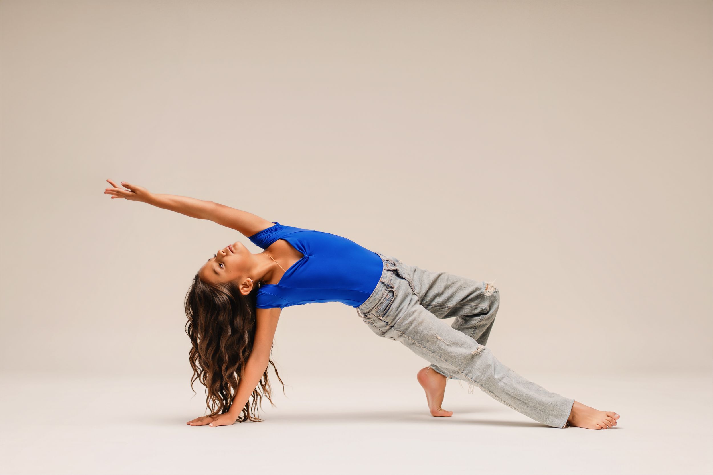 Dancer striking a powerful pose with bold lighting + artistic styling. Professional dance photography in Georgia and Florida + beyond